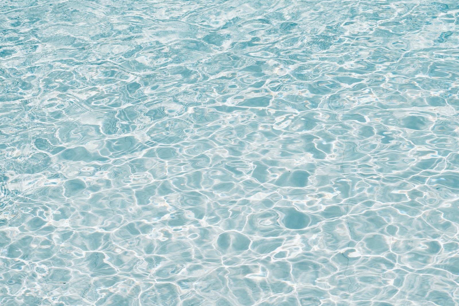 A blue and white water surface with ripples