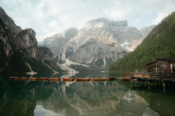 A body of water with mountains in the background