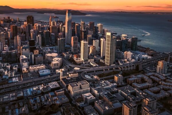 An aerial view of a city at sunset