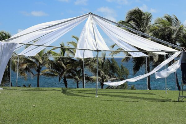 white canopy tent on green grass field during daytime