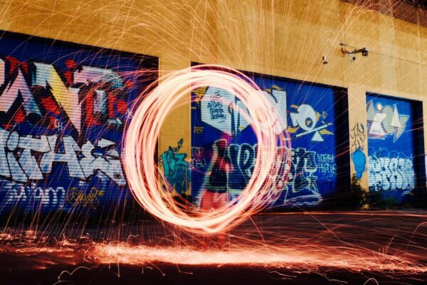 time-lapse photography of woman using steel wool