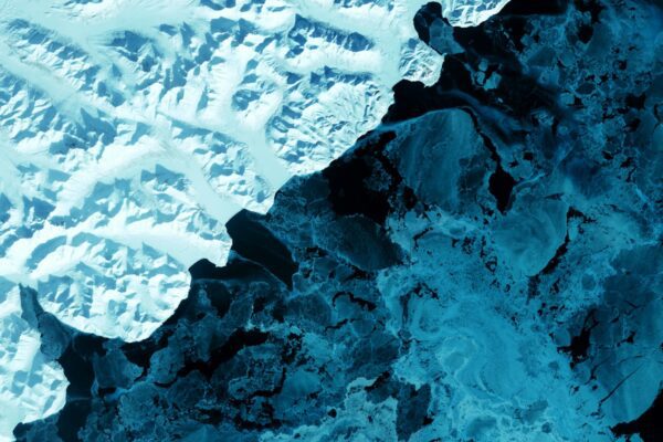 an aerial view of a snow covered mountain