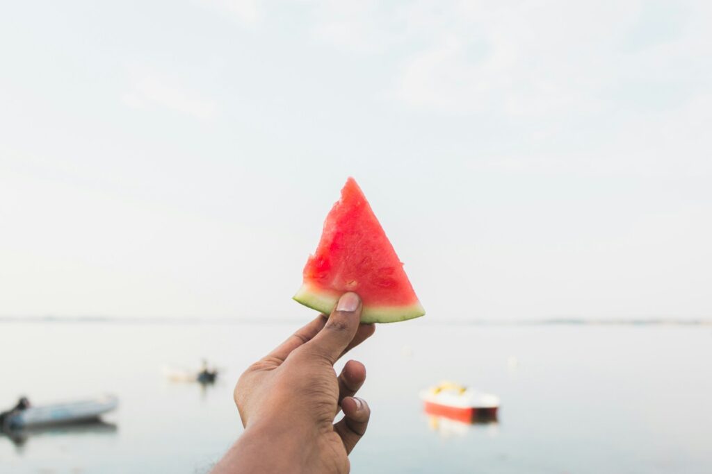 person holding sliced watermelon, Watermelon Quotes