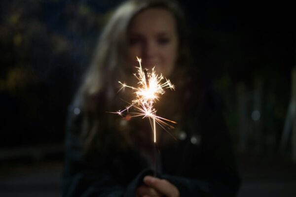 woman holding sparkler