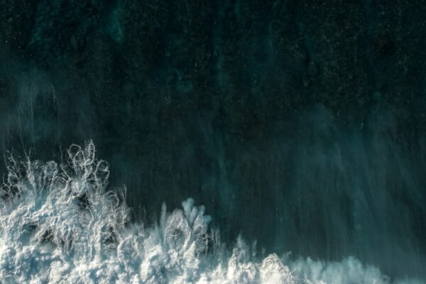 A surfer riding a wave in the ocean