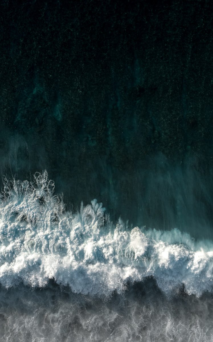 A surfer riding a wave in the ocean