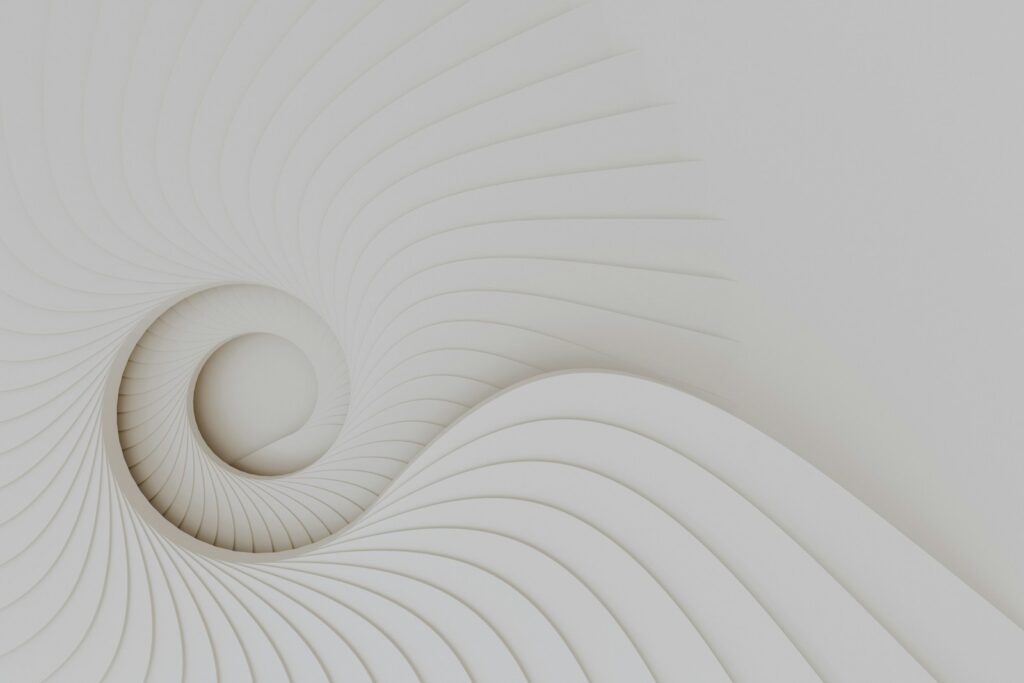 A white wall with a spiral design on it, therefore synonyms